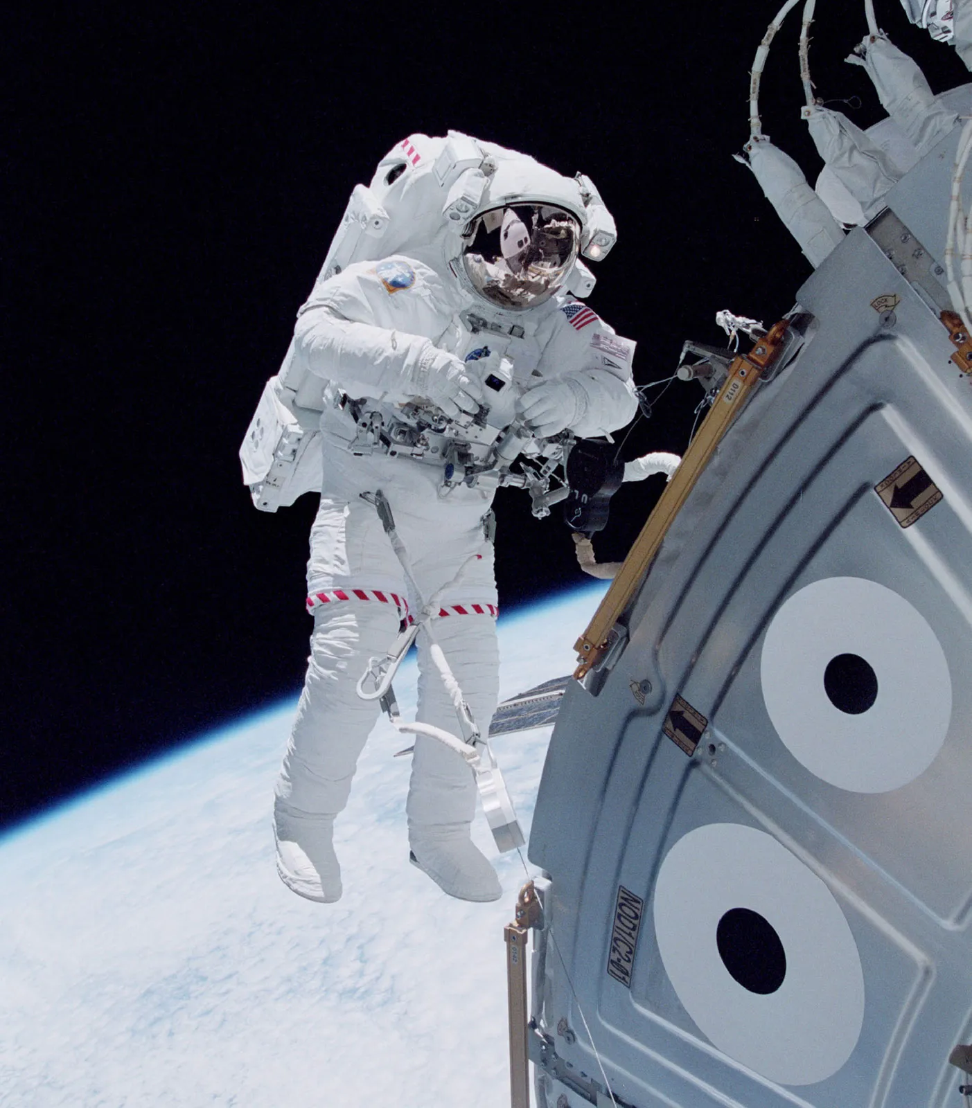 U.S. space shuttle astronaut Michael Lopez-Alegria floating in space outside the Unity module of the International Space Station in October 2000, during an early stage of the station's assembly in Earth orbit. © NASA